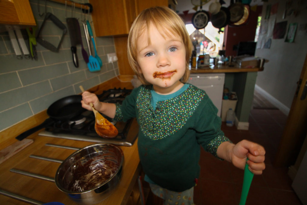 Daughter mixing ingredients for nut butter cups