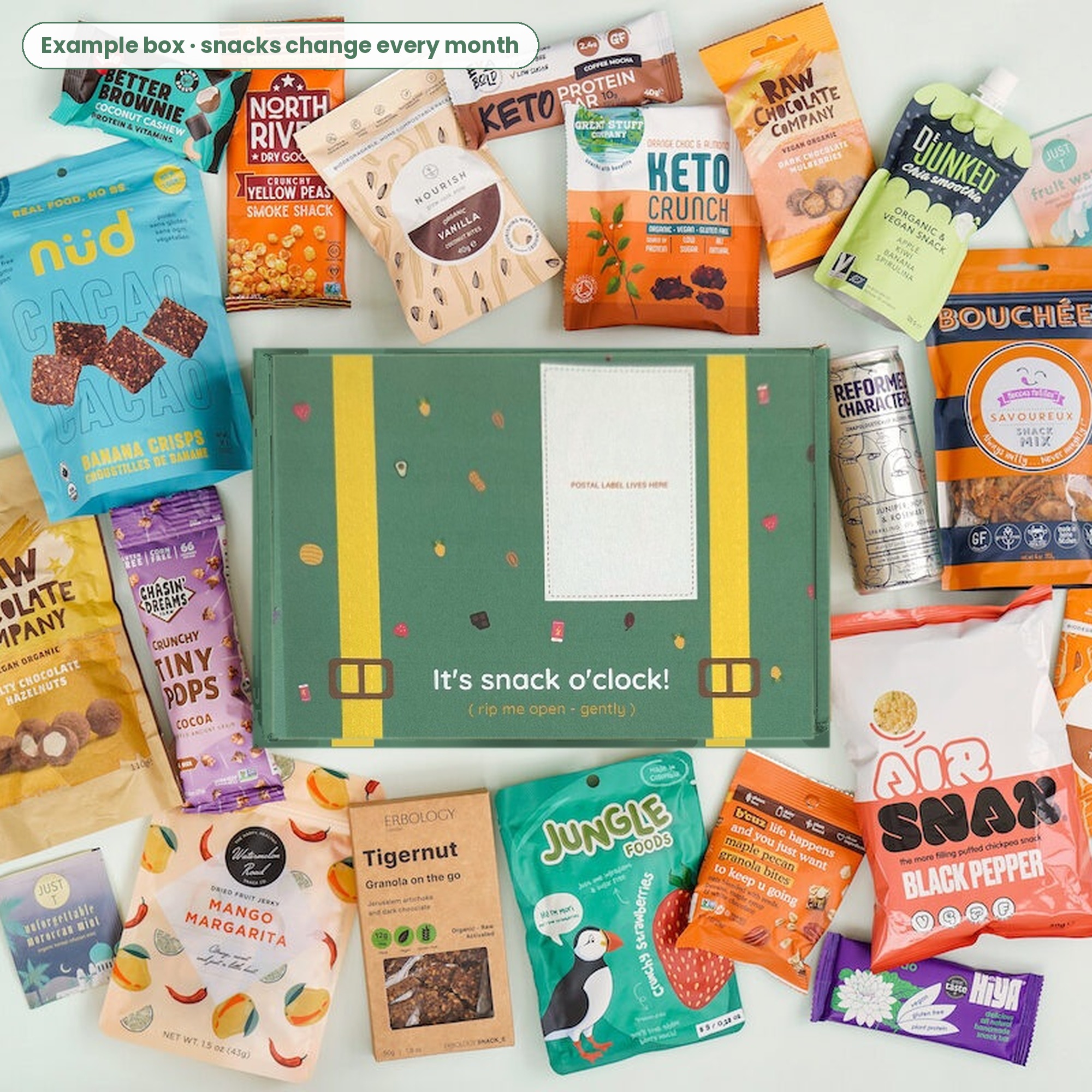 Green Treat Trunk box surrounded by healthy snacks from small UK brands